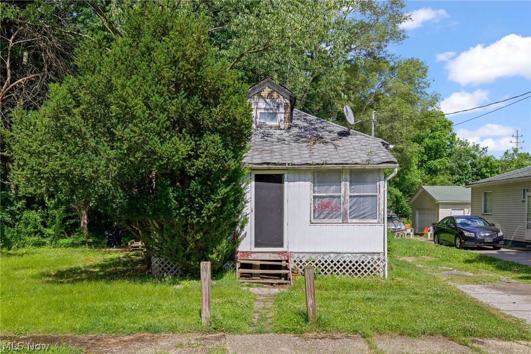 Opportunity knocks.....This one bedroom home has a finished attic space and includes a second parcel. Great opportunity for an investmet property or rehab project. Located on a dead end street it is convenietly located to the interstaee, shopping and restaurants. Property is being sold AS-IS