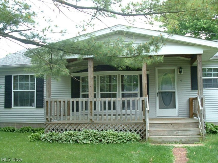 GREAT HOME; GREAT BUY.  Enjoy iced tea on the shaded front deck as you look out across open fields.  A large front bay window and an electric fireplace in the great room make an inviting entrance to this very clean, well cared for three bedroom, two bath home with vaulted ceilings.  Kitchen features include a center island and a pantry.  The master bedroom has a walk-in closet and its bath has the winning combination of a garden tub and separate shower.  For energy efficiency there are 5 ceiling fans.  All appliances are included making this a great starter or retirement home.  There is a third porch off the laundry room.  The man of the house will love the tandem 4 car garage with its own large covered porch on the back.  Lots of mature landscaping and trees add to the ambiance of this great property,  It's just waiting for new owners to call it home.