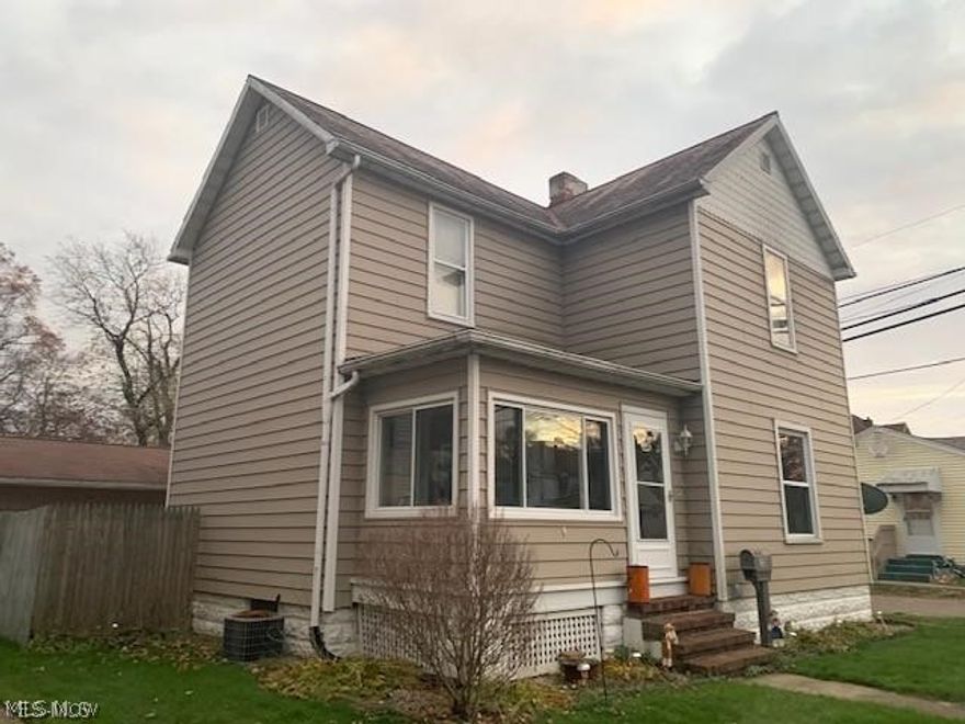 Charming 2-story home. Enter on the enclosed front porch. Sit and stay a while.So much charm inside and outside. Nice size living room, dining room and eat-in kitchen. First floor half bath. Deck off kitchen leads to the brick patio and fenced-in yard. 3 bedrooms up and full bath up. Finished family room in the lower level. Newer 2.5 car garage.