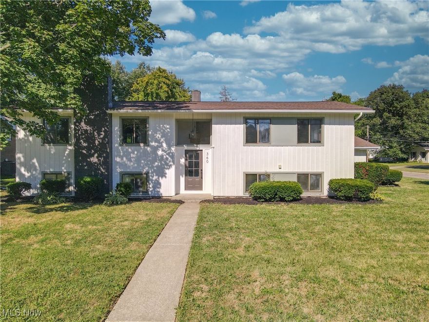 Welcome home to 360 Marviel Dr. Fairlawn OH 44333. Home shoppers, stop your search because this home just might have everything you have been dreaming of and more! Centrally located in Fairlawn, Ohio, sits this bi-level fully remodeled and updated 4 bedroom home.  15 ft vaulted ceilings, an abundance of natural light, open floor plan, and plenty of space for the whole family are just some of the many special features this home has to offer. Live and host in both comfort and style with the fully updated kitchen complete with luxury quartz counter tops, new cabinetry, new appliances, and ability to entertain both inside and outside. This home offers main floor living as well! Down the hall from the main living area is the master suite featuring a custom wood accent wall, a luxurious ensuite bathroom and your own private walk out 4 seasons room. Two additional bedrooms and a full bathroom finish off the main level. Continue your living and entertaining In the fully finished and updated lower level featuring an oversized family and rec room. Cozy up around the fireplace that features a custom wood detail surround. Down the hall is a third full bathroom and a fourth bedroom. Lastly, the brand new large mudroom / laundry room combo is right off the walk-out door that leads back up to the garage. Before ending your tour, take a walk around the property and envision yourself hanging out on the deck or patio while the kids and pets play in the yard. Close to Copley-Fairlawn Schools, highway access, restaurants, shopping, entertaining, and more, this home has everything you’ve been looking for! Come take the tour in person today and make 360 Marviel Dr. Fairlawn OH you’re next home.