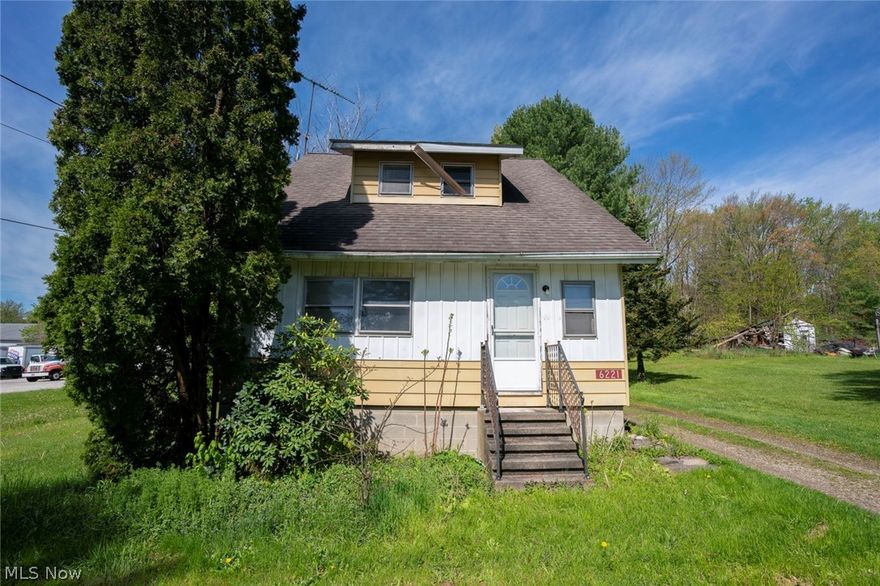 Perfect investment opportunity located right off of SR-59 and within minutes from Kent State University! Plenty of space in this Cape Cod/Colonial style home. The majority of the first floor has been refinished with laminate flooring. Neutral paint throughout and tons of natural light! Spacious living room with entrance to the first floor bedroom (3rd bedroom). Dining room located right off of the kitchen offers great space for entertaining! Additional living room/family room (currently has pool table) has sliding doors with access to the back deck. This room could be used as a first floor master suite, but does not have a closet. Right off of this space is a full bathroom and laundry area. Heading upstairs, you'll find two additional bedrooms and another full bathroom. 2.5 car garage! Don't wait to make this hope your own! Needs some TLC.