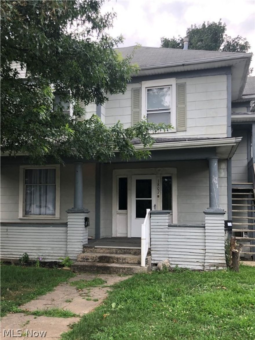 Beautiful potential 2 story home.  All original woodwork and floors, staircase, pocket doors, entry columns and moldings.  This home is set up as a duplex currently but can easily be made for single family by removing partition tacked in on staircase.  All new first floor bath, 2019 new drywall in kitchen with new base cabinets.  2 new furnaces and duct work in January 2019.  One new hot water tank on 1st floor.  Small sun room off kitchen has sweet possibilities.  2nd floor still needs work.