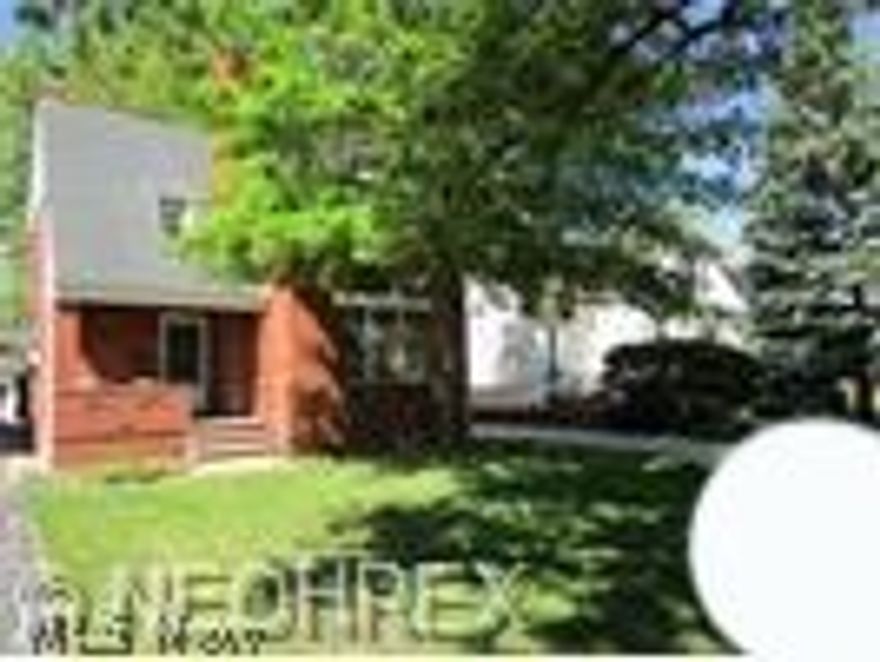 Brick colonial North of Lakeshore Blvd with charming front porch on tree-line street.  Living Room features fireplace and refinished hardwood floors are throughout the first and second levels. Eat-in-kitchen features some appliances and view of lovely backyard. The three bedrooms are on the second level with the full bathroom plus a walk-up attic for plenty of storage.  The finished Rec Room features a fireplace and full bathroom. Basement was waterproofed in 2005.  One year home warranty with America Preferred !