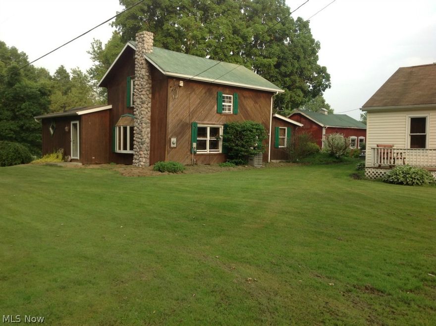 A Great country home Originally a log home with and addition of a kitchen 26x18, w skylights.  Large Bathroom w/jacuzzi tub, skylights and stand alone 
shower.  Additional investment home 2br, 1 bath, LR and kitchen.  Both homes are on a approx . 2 acre lot w/large 4 stall barn and 4 car garage.  Plbg in main home is 11 yrs. tin roof , ornamental pond, and Home Warranty!

Investment home brings in $550.00 a month.  690 Sq Ft.  Ranch style
24 hr. Notice to show.   Tenants!