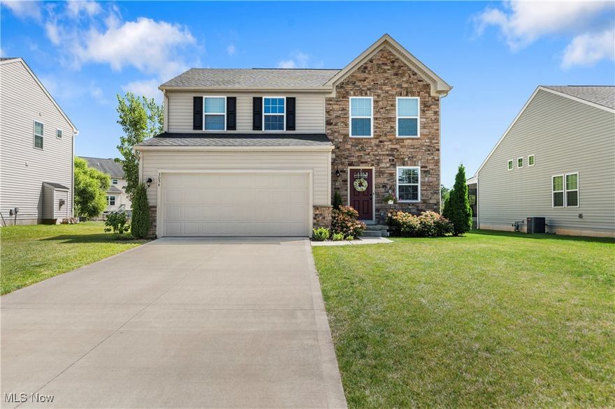 TURN KEY! MOVE IN READY!! LOW MAINTENANCE! Plain Local Schools! Step through the large foyer to find a convenient half bath with pedestal sink and chrome finishes. Make your way down the hall and pass by a practical mudroom space connect to the entrance of the attached two car garage. Continue on to the open-concept main floor that seamlessly blends the living room, kitchen, and sunroom, creating an inviting space for both relaxation and entertaining. The living room is a cozy yet elegant space, highlighted by a stylish gas FIREPLACE that adds warmth and charm. The eat-in kitchen is a chef's dream, featuring pristine white cabinets, a kitchen island, a walk-in pantry, stainless steel appliances, and a REVERSE OSMOSIS system for pure, clean water. Just off of this space is a large SUNROOM that is the perfect space to relax in the mornings with a hot cup of coffee to enjoy views of the spacious backyard.  Upstairs, you'll find three beautifully designed bedrooms. The master suite boasts a large walk-in closet (8x8) and an ensuite bath with a walk-in shower, a vanity sink, and sleek chrome finishes. A second full bath with a shower-tub combo serves the other bedrooms, ensuring comfort for all. For added convenience, the second floor includes a dedicated laundry room, making household chores a breeze. The basement (33x24) is just waiting to become additional living space and boasts built in shelving. The backyard has a large CONCRETE PATIO perfect for entertaining as well as views of a small pond. This modern home combines luxury, functionality, and impeccable design, offering a perfect sanctuary for contemporary living. Contact us for a showing today!