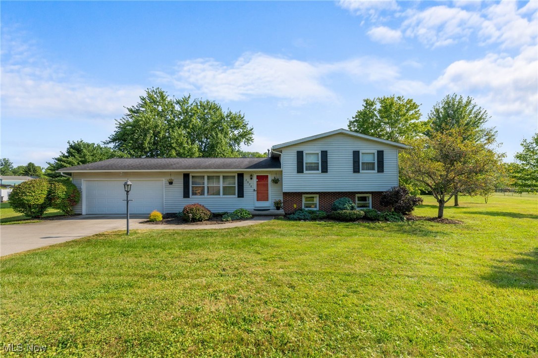 Step inside this well-maintained split-level home in Shalersville, offering 3 bedrooms, 2 full bathrooms, and a total of 1,972 finished square feet—including a beautiful 168 sq ft four-season sunroom with cathedral ceiling and Anderson windows! Situated on 3.48 scenic acres, this property provides space, comfort, and privacy. The main level features newer carpeting in both the living and dining rooms, with a layout that flows seamlessly from the dining area into the kitchen and four-season room, creating a warm and inviting space for everyday living and entertaining. A newer sliding glass door leads to a 12'x12' maintenance-free composite deck—ideal for relaxing and enjoying the peaceful outdoor setting. On the lower level, you’ll find a spacious family room with a vent-free corner fireplace and a handcrafted red oak mantle that can heat most of the house, plus a bonus area with plumbing in place—perfect for a future 4th bedroom and 3rd bathroom. Additional highlights include a 2-car attached garage, whole-house carbon water filter, hot water tank (2021), and wired security system. Other updates and features include a vinyl-coated black chain-link fence, newer carpeting in the master bedroom and Cortec flooring in the bathrooms. Located in the desirable Crestwood School District, this home sits conveniently between the Ohio Turnpike and Route 480, with quick access to Streetsboro, Aurora, Kent, Hudson, and Twinsburg—come take a look today!