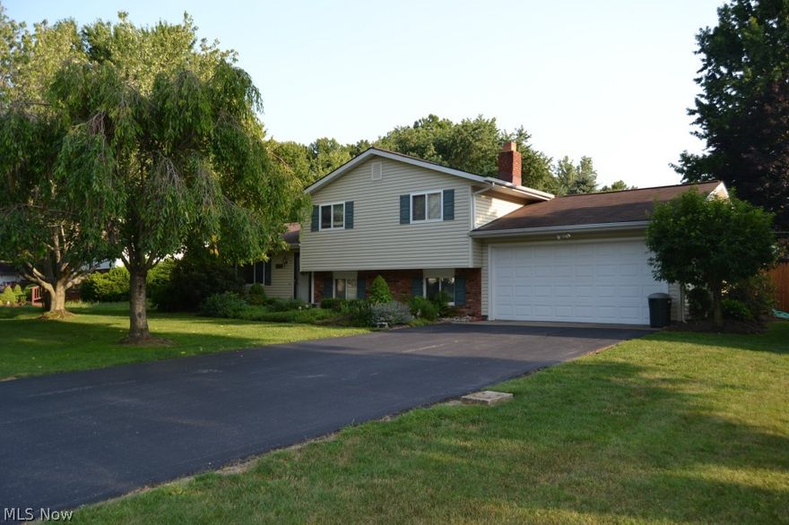 Welcome to this updated home with over 2ooo SF. As you pull in, you will notice the manicured and well cared for yard. Enter into a beautiful foyer with laminate that flows nicely into the spacious and spotless Living Room and adjoining Dining area. If you love beautiful newer cabinets, updated fixtures, counter tops and stainless steel appliances, you will fall in love with this Kitchen. This amazing Kitchen flows into the room you may never want to leave, the grand and gorgeous Four Seasons Room that overlooks a stunning yard, Gazebo and Pool with Deck. Once you leave the Four Seasons Room, you can make your way to the lower level Family Room with Fireplace, full Bathroom and Laundry Room. The Family Room leads up to a hidden gem, the Bonus Room/ Fourth Bedroom that is beyond spacious in size, closet space and charm. On the upper level you will find a full Bathroom and 3 additional Bedrooms including the Master Bedroom that has all the closets and space you could want. Welcome Home!