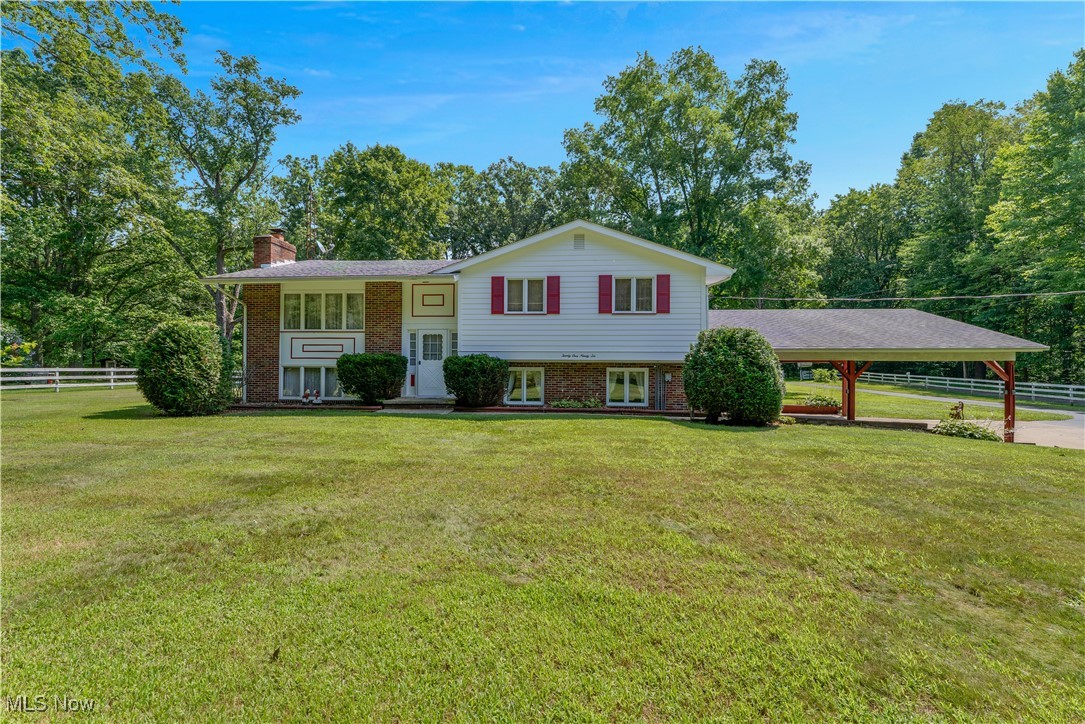 For over 50 years, this special 3 bedroom, 2.5 bath bi-level home has been the heart of countless memories, laughter, and love. Now, for the first time in decades, it’s ready to welcome a new chapter. Tucked away on nearly 4 peaceful acres, this property offers a rare combination of space, privacy, and potential. This beautiful landscape offers a pond, barn, and a 2 car attached garage with carport to create the perfect setting for country living, whether you're looking to garden, raise animals, or simply enjoy the quiet. Inside, you’ll find a home that has been lovingly and meticulously maintained over the years. The main level features a light filled living room with cathedral ceilings, an eat-in kitchen with a breakfast bar, and a 3-season sun porch that opens to the pool area. The primary suite includes its own full bath. Downstairs, the cozy lower level offers a second living area, laundry room, half bath, and walkout access to the in ground, fenced in pool, once the centerpiece of family gatherings and summer fun. If you're looking for a property with soul, space, and endless opportunity, you won’t want to miss this one of a kind homestead.