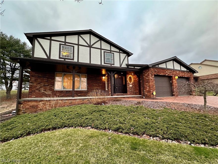 Stunning Tudor home in the sought after Country Club Hills Subdivision. This home welcomes you with a paver
lined drive and walk way to a covered front porch with custom architecture. From there the home invites you into a warm
foyer that leads to the formal sunken living room and the the formal dining room. Next you have the gorgeous updated
kitchen with no detail left unturned. Off the kitchen is a cozy family room with a large fireplace. Off the family room is a
large four seasons sun porch with tons of natural light and European feels. Upstairs is a large master bedroom with ensuite and an abundance of closet space. There are also two other bedrooms and another full bath. The lower level is a
blank slate for your imagination. It has another fireplace and rough ins for a bathroom. Outside is perfect for entertaining
with a large deck with tons of privacy. There is also a shed in backyard as well. Home also features a two car garage on
main level as well.