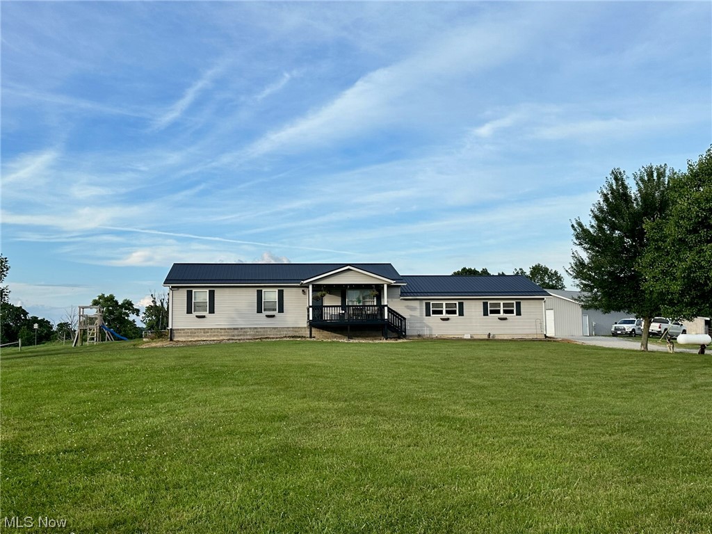 Looking for a Mini Farm in Guernsey County? Look no more! This 10.99 acre mini farm has fenced pasture, small barn, large 30x40 shop with concrete floors, separate electric service and beautiful views. The 2004 built ranch home offers 4 bedrooms with a lower level office which could be a 5th bedroom. The home has a huge open kitchen/dining room area, 2.5 bathrooms, and a 2 car attached garage. The newly finished full basement has plenty of living and recreation space as well as the office, a 4th bedroom, half bath, laundry and the utility room. New roof and hot water tank. Public water and septic. Spectrum internet is also available. Located only 20 minutes from New Concord or Byesville. Call today to take a private tour.