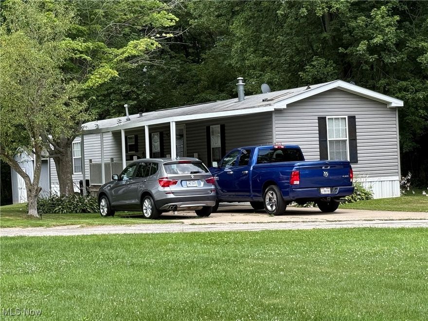This is a beautiful mobile home situated in Mobile Acres Park, Lot #16.  This home features an open concept living room and kitchen with lots of nice cupboards.  Stove and fridge are 2 years old.  The seller put a new hot water tank on 6 months ago. There are 2 bedrooms and 2 full baths.  There is a walk in closet that is 9 x 8 off the master bedroom.  There was a 3rd bedroom but seller removed a wall and combined the 2 bedrooms.  There is a 8 x 16 covered deck which is newer as well as a 10 x 12 shed to store outside items.  The flooring in the living room and kitchen need replaced and seller has the flooring and will leave it for the new home owner.  The park pays for sewer and garbage and owner pays all other utilities.  Rent is $320 per month.  Landlord approval prior to purchase.
