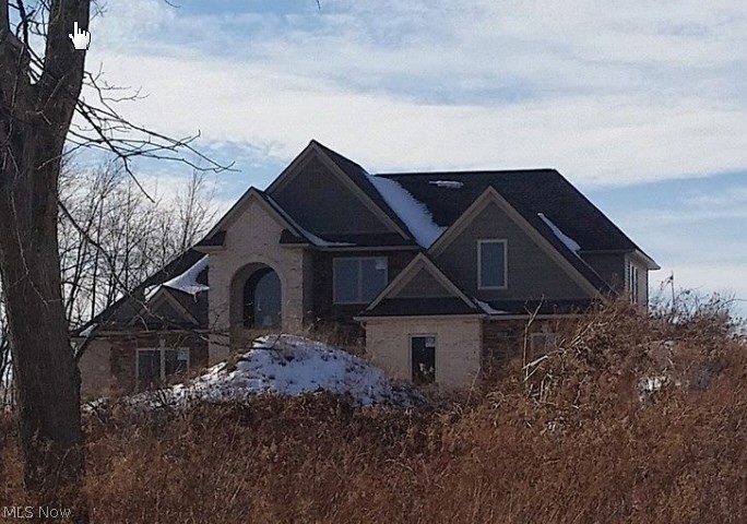 Exciting Opportunity! Beautiful new construction home on scenic lot (5.0 Acres) that is estimated 70% complete. Bring your own contractor/builder to finish! The first floor features a 2 story foyer, custom kitchen with cherry cabinets and granite counter tops. The master suite with a glamour bath. The two story great room overlooks a private backyard. Large laundry room. The dining area is open and spacious with crown molding. The second floor features two additional bedrooms, bonus room and loft area. Lower level has access from garage and first floor. 2Plus attached garage. Pole barn is finished with 1400 square feet of space plus electric.