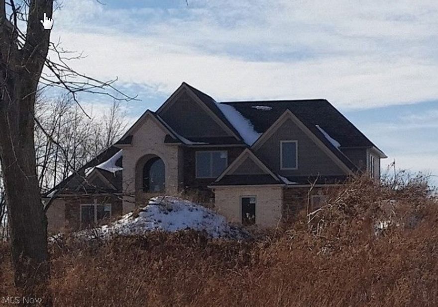 Exciting Opportunity! Beautiful new construction home on scenic lot (5.0 Acres) that is estimated 70% complete. Bring your own contractor/builder to finish! The first floor features a 2 story foyer, custom kitchen with cherry cabinets and granite counter tops. The master suite with a glamour bath. The two story great room overlooks a private backyard. Large laundry room. The dining area is open and spacious with crown molding. The second floor features two additional bedrooms, bonus room and loft area. Lower level has access from garage and first floor. 2Plus attached garage. Pole barn is finished with 1400 square feet of space plus electric.