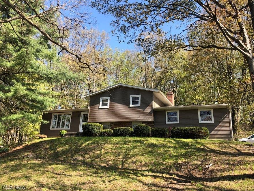 Auction 10/7: Take the time to check out this split-level home on 1.321 wooded acre parcel. This home with a 2-car garage, features 3 bedrooms and a full bath on the upper level. The living room, kitchen, and dining room make up the main level. And a family room with a woodburning fireplace, 1/2 bath, and the mudroom/laundry area in the lower level. The basement houses the utilities and is unfinished, great for storage. Utilities to the home include propane forced air furnace, Central Air and well & septic, as well as a backup generator. The interior of the home needs remodeling but has had substantial updates including being re-roofed (including all new sheeting) and re-sided, a new HVAC system, hot water heater, garage door opener, and well pump. Check out this home today to see how, with some TLC, you can make it your own.