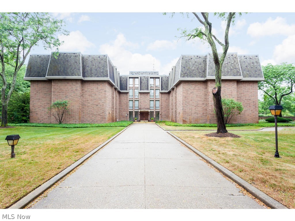 Lovely & spacious third floor rear-facing 2 BR 2.5 bath condo with great updates and lovely private terrace in Fairlawn's Camelot. Enter to foyer with coat closet that opens to huge (25 x 19) great room with large floor to ceiling windows with private view that overlooks lush backyard. Crown molding, picture frame wall moldings and beautiful leaded glass transom above door to balcony that looks to treed yard accentuate classic elegance of this unit. Dining room off of kitchen offers lots of space for entertaining. Kitchen beautifully renovated with updated cabinetry with undercabinet lighting, gorgeous & unique granite countertops and backsplash, newer stainless steel appliances, built-in wine rack, wood-look luxury vinyl plank flooring and convenient desk area. Laundry room with luxury vinyl plank flooring, sink and cabinetry that provides more great storage. Master bedroom is extremely spacious and features walk-in closet, crown molding and floor-to-ceiling window for great light. Spacious en suite master bath features updated cabinetry. Second bedroom/den features crown molding, cozy electric fireplace and also has spacious en suite full bath. Hallway features built-in linen closet. Camelot features pool with patio and large community room. This home comes with 2 reserved well-located parking spaces in the garage located underneath the building. Carefree, secure and convenient- don't wait to call this beautiful home yours.