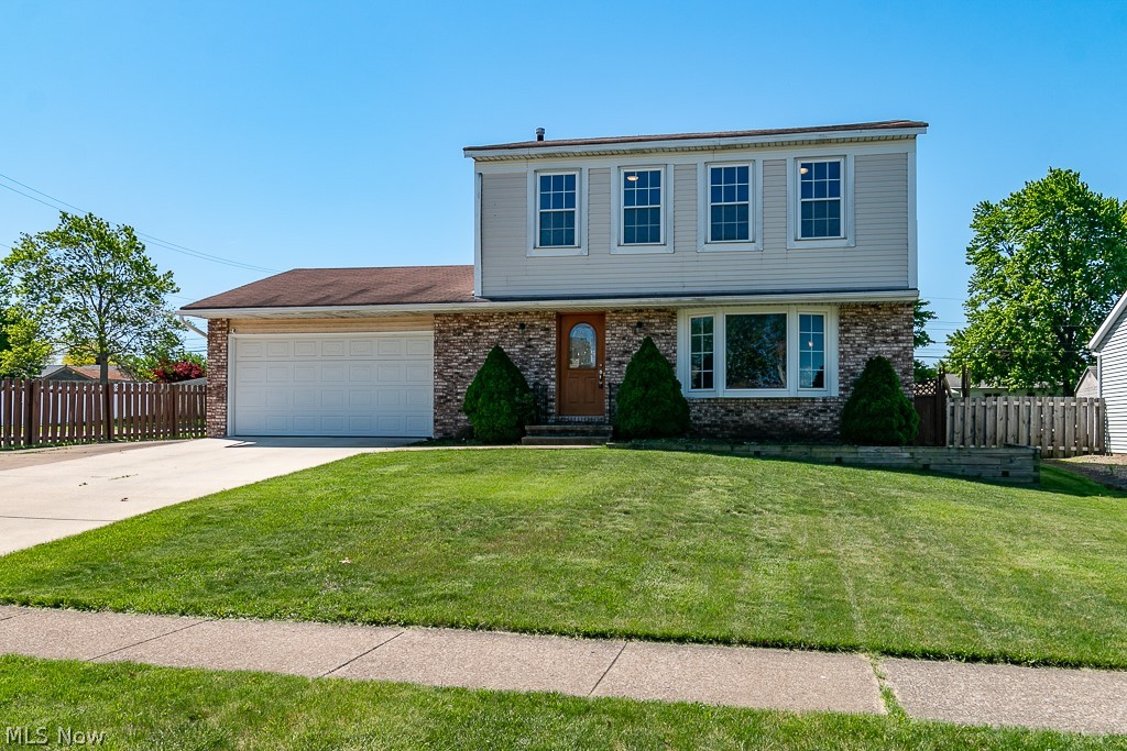 This stunning corner lot colonial is pristine and ready for its new owner. With 3 bedrooms, 1.5 baths and 1/2 finished basement there's no shortage of space. Updates in 2017 include: a rear stamped patio, carpeting, and laminate flooring. Open concept kitchen with newer stainless steel appliances overlooks family room with vaulted ceilings, fireplace and dual sliding glass doors to outdoor patio. Living room is bright with on-trend paint colors and a beautiful bay window allows for loads of natural light. Updated half bath on main floor. Very spacious master bedroom with 2 additional rooms and full bath with double sinks complete the second the floor. Two car attached garage and newer poured driveway. Don't miss out on this one!!!