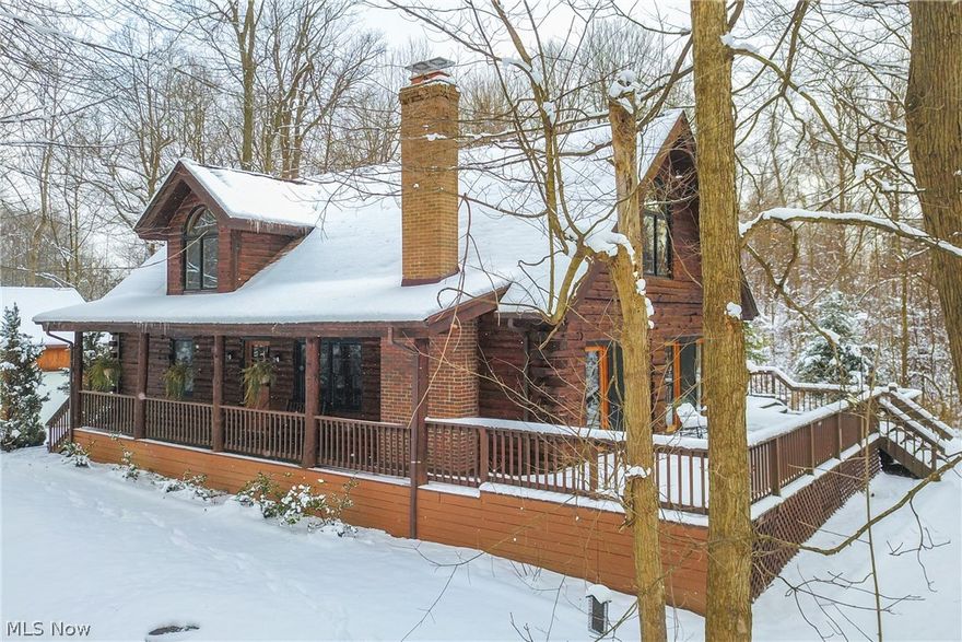 Inviting log home with an open floor plan that exudes comfort and character. Spacious Great Room features vaulted ceilings and a stone faced wood burning fireplace with full windows for incredible picturesque views.  Another wood burner on slate hearth comforts the dining area that has french doors leading to the wrap around deck and covered front porch. Kitchen offers plenty of room and an island with a built-in range. First floor is completed by two bedrooms and a full bathroom. Master bedroom and full bathroom upstairs are complimented by the open loft. Updates include: Roof (2015), Kitchen Floor (2016), Upstairs Floors (Refinished in 2016), Driveway (Repaved in 2017), Basement Painted and Utility Room Enclosed (2016). 3+ Car Detached Garage
and Full walk out Basement gives you plenty of space ready finish for a recreation area and/or used for storage. Beautiful landscaping and annual flowers surround this unique 2.5 acres that comes complete with raised flower/garden beds, small f