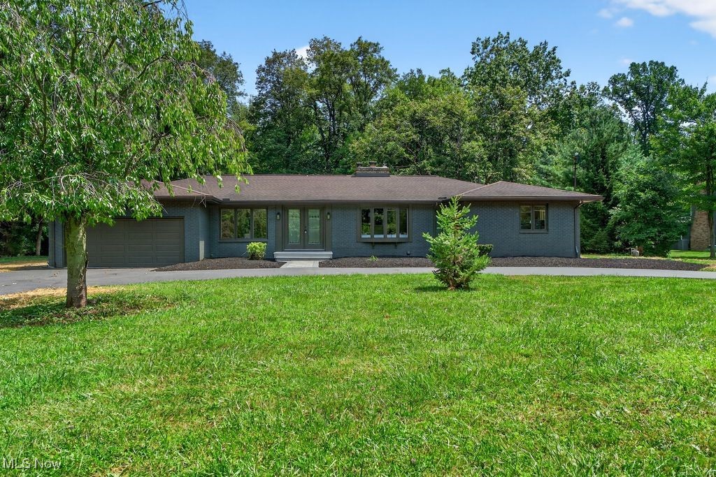 Fully renovated and move-in ready, this stunning 4-bedroom, 2-bath ranch in Bath Township offers over 2,700 sq ft of beautifully updated living space on a private 1.63-acre lot. The home features a new circular driveway, fresh landscaping, modern exterior paint, and a brand-new concrete patio. Inside, you’ll find a bright, open floor plan with new wood-style flooring, recessed lighting, and a spacious living room that flows into a sunroom with French doors. The completely remodeled kitchen boasts white shaker cabinets, herringbone tile backsplash, black solid-surface countertops, stainless steel appliances, and ample pantry storage. Both full bathrooms have been tastefully updated with contemporary tile and finishes. Generously sized bedrooms, new windows and sliding doors, and an attached 2-car garage complete the home. Nestled on a quiet street surrounded by mature trees, yet close to parks, highways, and top-rated schools—this property delivers modern living with serene outdoor space. Brand new Septic system, all new hvac, hot water tank, and mechanicals, well mechanicals, electric, basement waterproofed with lifetime warranty, plumbing.