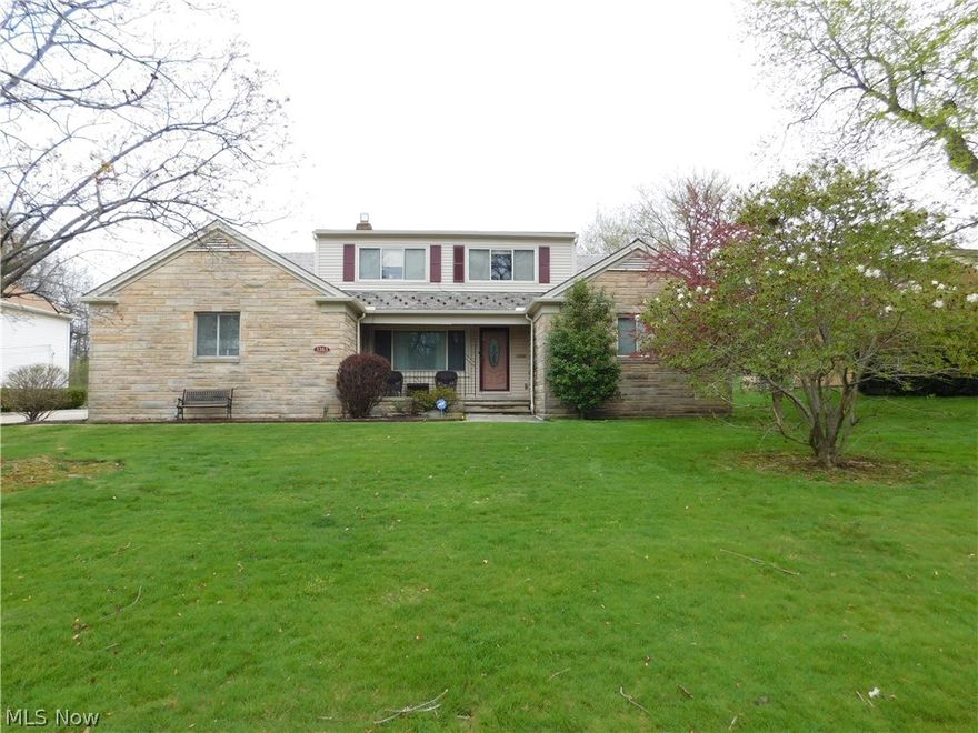 This spacious character-filled Beachwood Cape Cod backing up to the Canterbury Golf Course is an entertainer's dream!  The stone and brick home boasts wonderful room sizes and fabulous entertaining spaces.  Large kitchen with painted natural wood cabinets, granite counters with double bowl copper sink and beautiful hardwood floors flow openly into huge rear living/sun room.  Entertain, relax, or play in the adjacent family room with beamed ceilings, newer carpet, and natural brick accent wall with fireplace and indoor grill!  Formal dining room with newer cherry wood floors and front living room provides additional living and entertaining space.  Three bedrooms and two full baths also on first floor including the master suite with updated master bathroom.  Large mud/laundry room and additional half bath completes the first floor.  Upstairs, find a cozy loft/reading area, full bath, entire wall of closets for incredible storage and two bedrooms.  Massive lower level with expansive recre