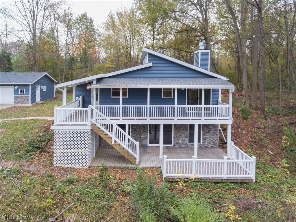 If your looking for a one of a kind custom ranch home with walk out basement and a little bit of land, come and take a look at this amazing property! This home sits back off the road and has been totally remodeled inside and out! Located in South Amherst in the Firelands School District. You will be pleasantly surprised by the spacious great room with vaulted ceilings, stone fireplace and sliding glass door that leads to the 2 tier maintenance free deck overlooking the ravine and creek below. The New kitchen features granite countertops and a breakfast bar. On the first floor you also have 3 bedrooms, full bath and a master bath. The lower level is completely finished with a HUGE rec room/ family room with another wood burning fireplace also with sliding door to the deck. A conveniently located full bath, bedroom and laundry room are also located down there. Relax on the deck while overlooking the ravine and watch the wildlife pass by. There is also a detached 2 car garage with conc