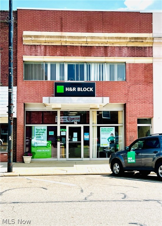 Here's a great opportunity to own an income producing property with plenty of room to expand. This 1920 sold brick built building located in Rittman, OH is available. Each floor is 2000 sq ft. Home to H&R Block, a one bedroom apartment, a full unfinished loft and a full walk out basement that is mostly finished and is ready for you. The loft can be made into two or three apartments or a full uptown urban oasis, and it even has rooftop space and an elevator. The basement is completely secure and is perfect for those needing complete privacy and security. Current rent is $550.00 per month (tenant pays own utilities except for water, sewer and trash) and $600.00 (tenant pays own utilities except for water, sewer and trash). Plenty of parking in front and behind this building. There are several new tenants in downtown Rittman with more on the way. You won't find a building like this anywhere. New air conditioning, updated electric, solid hardwood floors in the loft and NOTHIN