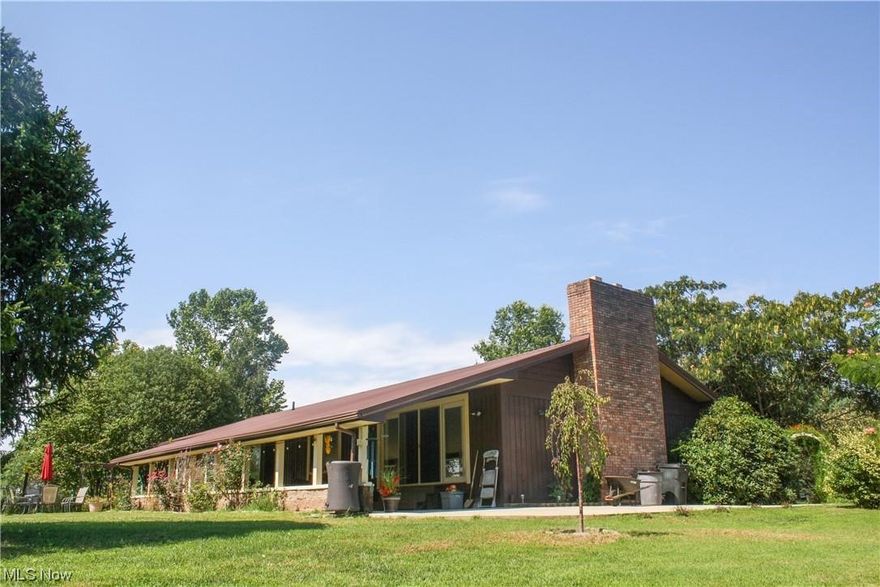 Spacious ranch style home sitting on over five acres and less than 25 minutes to Parkersburg! Beautiful park like setting features a fully stocked pond, mature landscaping, several outdoor entertaining spaces and a view of the Ohio River! Possibilities for extra bedrooms. The interior of the open-floor plan home has a gym and "man cave" that will make everyone envious!