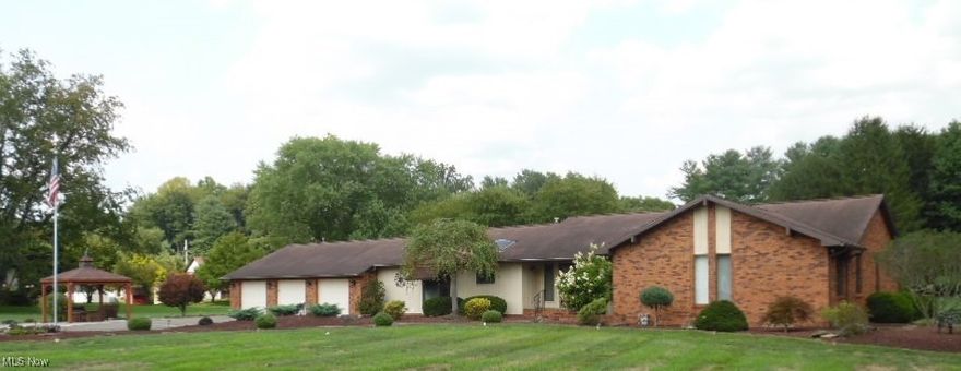 Live the good life in this custom-built ranch with breath taking architecture and attention to detail. You will first be greeted by the welcoming foyer that is adorned with inlaid oak flooring That opens to the sunken living room under a cathedral ceiling and the formal dining room. To the left is the gourmet kitchen with a cozy breakfast nook. the large family room is situated to the left rear and contains a brick floor-to-ceiling fireplace that is flanked by built-in bookcases on either side. Glass sliders lead to the inviting rear enclosed porch that faces east to greet you with the morning sun. The bedroom wing contains the en suite that offers a cathedral ceiling, huge master bath, and a walk-in closet along with another double closet. There are two more bedrooms and the guest bathroom that has just undergone a makeover. All of this situated on approximately 3.66 acres of nearly level land. the pole building measures 35'x48' for a total of 1,680 feet with two overhead doors of which one is 9 feet in height. The building is equipped with electricity, an outdoor covered patio, a dog run and a 15 foot wide x 10 foot high set of sliding doors at the rear.