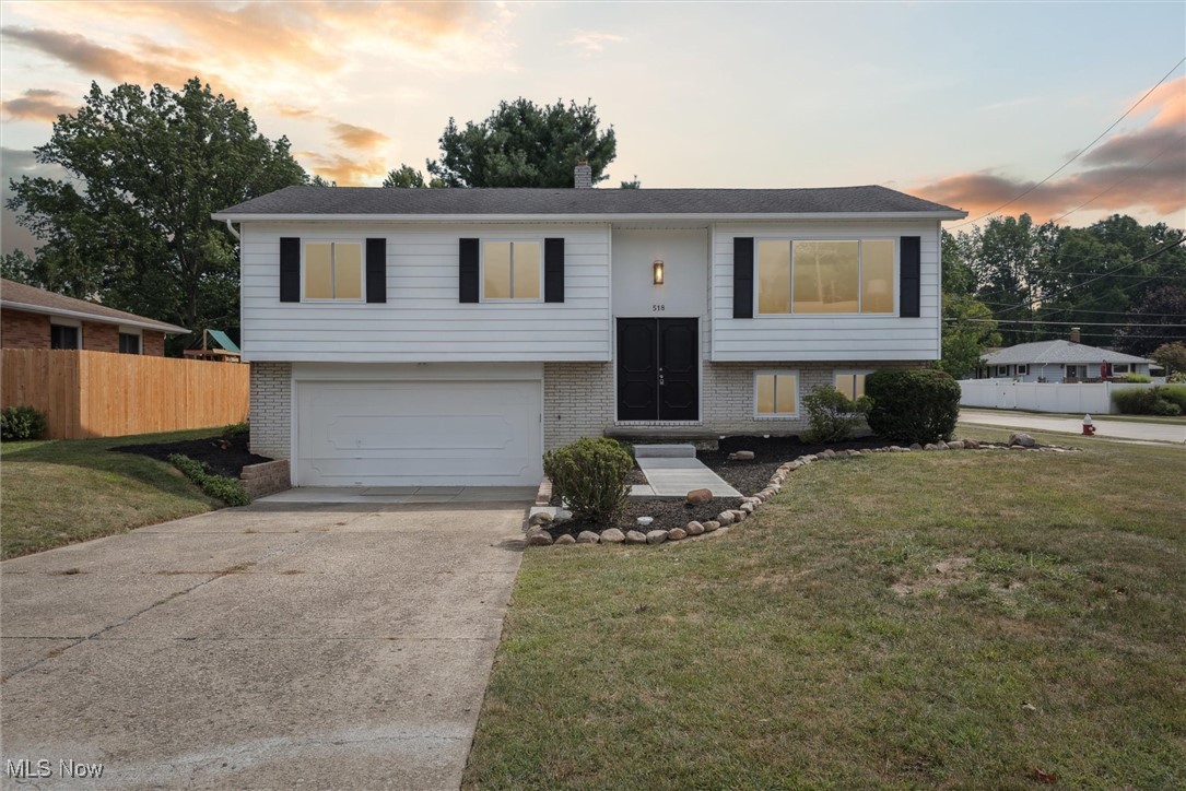 Welcome home to this beautifully remodeled split level. This home has is nestled on a large corner lot in the beautiful surfside development. It has two updated full baths, that both features new paint, flooring, and fixtures. The one on the main floor has an integrated Bluetooth speaker in the light. The updated kitchen is perfect for cooking and entertaining. It features granite countertops, all new appliances, enough counterspace for preparing any meal, and a large granite pass-through bar for socializing while cooking. The entire home has brand new high-end LVP flooring, while the three bedrooms on the main floor have plush new carpeting. The updates didn't stop there. The basement also features the same LVP flooring, a second full bath and an additional room that could serve as an office or an additional bedroom. This home is absolutely stunning and all it needs is your personal touch.