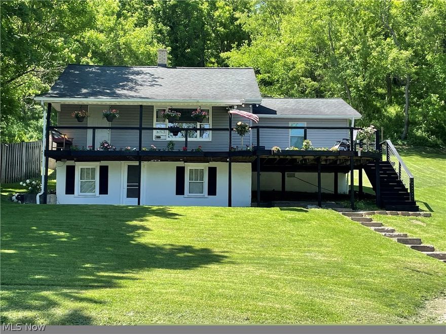 Nestled on a serene 2-acre lot, this charming, raised ranch boasts four bedrooms and two full baths. The owner's suite is very large and includes a walk-in closet. Step inside to discover a welcoming interior adorned with natural light and tasteful finishes throughout. The heart of the home is the well-appointed kitchen that features modern appliances and plenty of counter space. Venture outdoors through the French doors in the kitchen to an inviting covered back patio for all of your entertaining needs. Additionally, the property includes a barn that includes a man-cave area and a chicken coop, ideal for hobby farming or storage space for outdoor equipment. Conveniently located, this property offers a perfect blend of privacy and accessibility, providing a peaceful haven while still being within reach of amenities. The home also comes fully furnished. Make an appointment today!