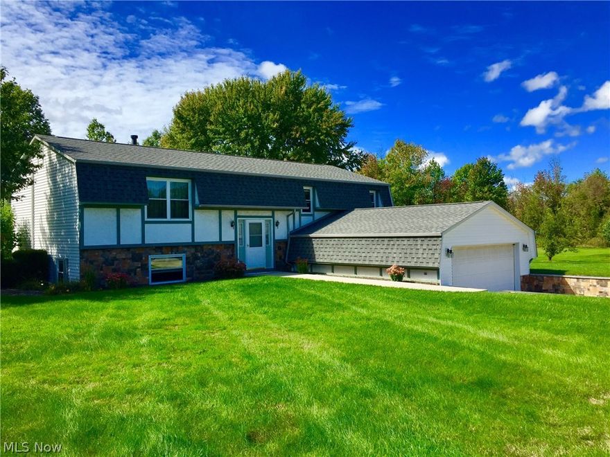 This unique, well-maintained home is most definitely not one to miss! Located in Harpersfield Twp, this home is close to the local wineries, Spire, Interstate-90 and downtown Geneva.  The home features 2x6 exterior construction which is fully insulated as well as many, many recent upgrades.  The driveway, retaining wall and stone facing on the home will certainly catch your eye as you drive by! Step into the main foyer that features ceramic tile and beautiful wrought iron railings.  As you continue up the stairs, you will enter into the spacious living room with an open flow to the dining room and kitchen. The kitchen features ample cupboard space and access outside to the multi-level deck that overlooks the spacious backyard.  As you continue down the hallway, you will come across three spacious bedrooms and a full bathroom featuring a double vanity.  On the lower level you will find the fourth bedroom featuring new carpet and a spacious utility/laundry room featuring ceramic floors.