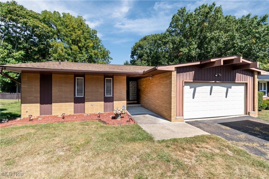 Welcome to this mid-century modern gem in the desirable Fairlawn Heights neighborhood, ideally located on the edge of Sand Run Metro Park in the heart of West Akron. This brick ranch offers 4 bedrooms, 3 full baths, and 1,682 sq. ft. of main-level living, blending timeless character with endless potential for customization. Step inside to a spacious foyer with a built-in planter that highlights the home’s unique mid-century design. A formal dining room flows into the open kitchen and expansive living room, anchored by a dramatic brick fireplace. Natural light fills the space through leaded glass windows and sliding doors that open to a private patio and deck. The backyard offers incredible potential to create your perfect retreat for entertaining or quiet outdoor living. All four bedrooms are conveniently located on the main floor. The primary suite shares a full bath with an adjoining bedroom, while the remaining two bedrooms share a second full bath. The expansive finished basement nearly doubles the living space and features another fireplace, plus a third full bath awaiting your finishing touches—ideal for a media room, recreation space, or guest suite. Additional highlights include central air, a private backyard, and proximity to highly rated public and private schools. With easy access to shopping, dining, entertainment, and both Akron and Cleveland, this home offers the perfect balance of convenience, character, and opportunity.