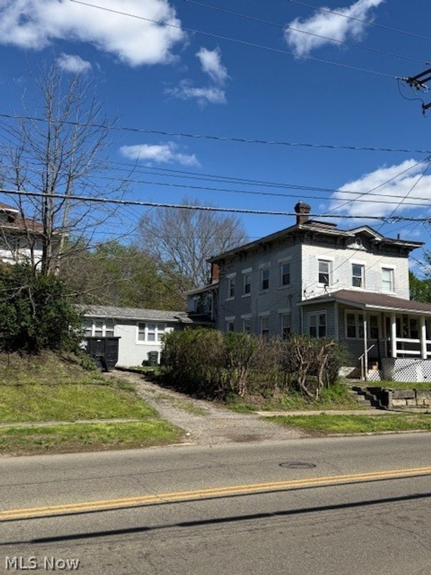 GREAT INCOME PROPERY!!  This triplex has been nicely updated and maintained.  It features an up and down style main duplex with each duplex having a little over 1600 square foot of living space.  Attached with its own entrance is a great efficiency.  Plenty of parking for all the tenants around the back side of the building.