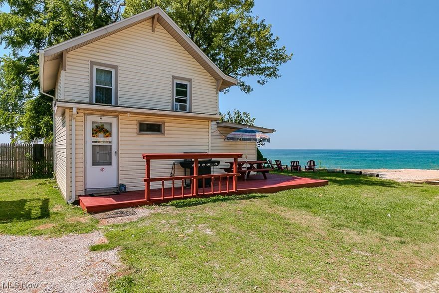 A rare opportunity to own a lakefront home on the shores of Lake Erie.  The perfect low maintenance waterfront residence, vacation getaway, or income generating Airbnb/VRBO investment.  This residence is just minutes from Geneva-On-The-Lake, Ashtabula Harbor, and Ohio’s esteemed wine country.  Enjoy spectacular unobstructed lake views from your home’s great room, master bedroom, deck, and yard.  Recently remodeled, the home now offers three bedrooms and two full baths, including a new full bath adjacent to the primary bedrooms and a versatile bunk room; it comfortably sleeps eight, with six in private bedrooms and two on a futon sofa. Updates include luxury plank flooring on the main level, refinished cottage-style wood floors upstairs, new Bosch dishwasher and Whirlpool washer/dryer, a two-year-old Whirlpool range with self-cleaning oven, and an upgraded/new electrical panel. Enjoy resort-style amenities and direct waterfront access for swimming, kayaking, and watersports—no association fees or restrictions.  From your home, enjoy lake breezes, sunrises, and sunsets, splash in the waves along the fully protected shoreline. Leave your lounge chairs and toys on the expansive property wide lakefront patio throughout the season! From the private ramp, launch your kayaks and PWCs.  This home is offered fully furnished with all appliances, is a move-in-ready and ideal for immediate enjoyment and rental income - Up to five parking spots are available for family and guests.   This property has been lovingly cared for and is ready to welcome its next owner - whether for weekends on the water, year-round living, or hosting guests in Ohio’s wine country.
