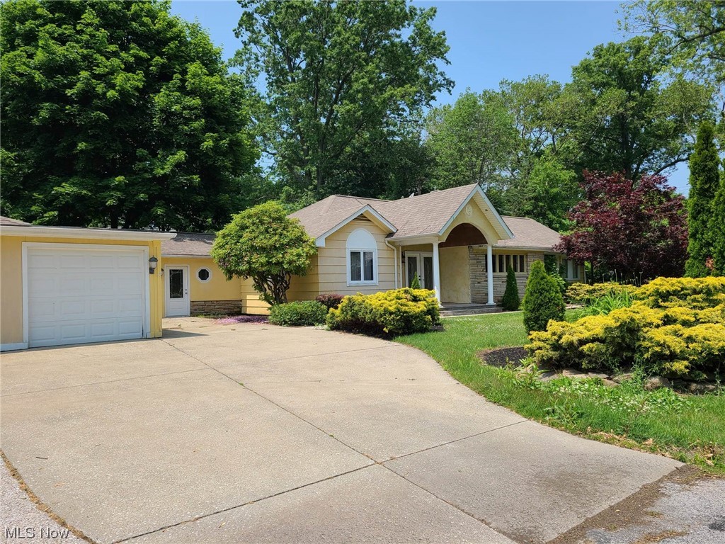Spacious lake view ranch along Madison's Coastline. This home offers an adjoining 1 bedroom accessible apartment or in-law suite with a full kitchen, its own entrance and separate street address. The main living space has 3 bedrooms including a MASTER SUITE with walk-in closet, a large open kitchen, living room and family room both with fireplaces, sunroom with overhead door, abundant storage space and closets, multi-level deck with vine covered pergola, many windows throughout for lots of natural light. There is a extra deep two-car garage with plenty of space. It is on a corner lot and is nicely landscaped. Being sold AS-IS Needs work and TLC. Easy to show! Agent owned.