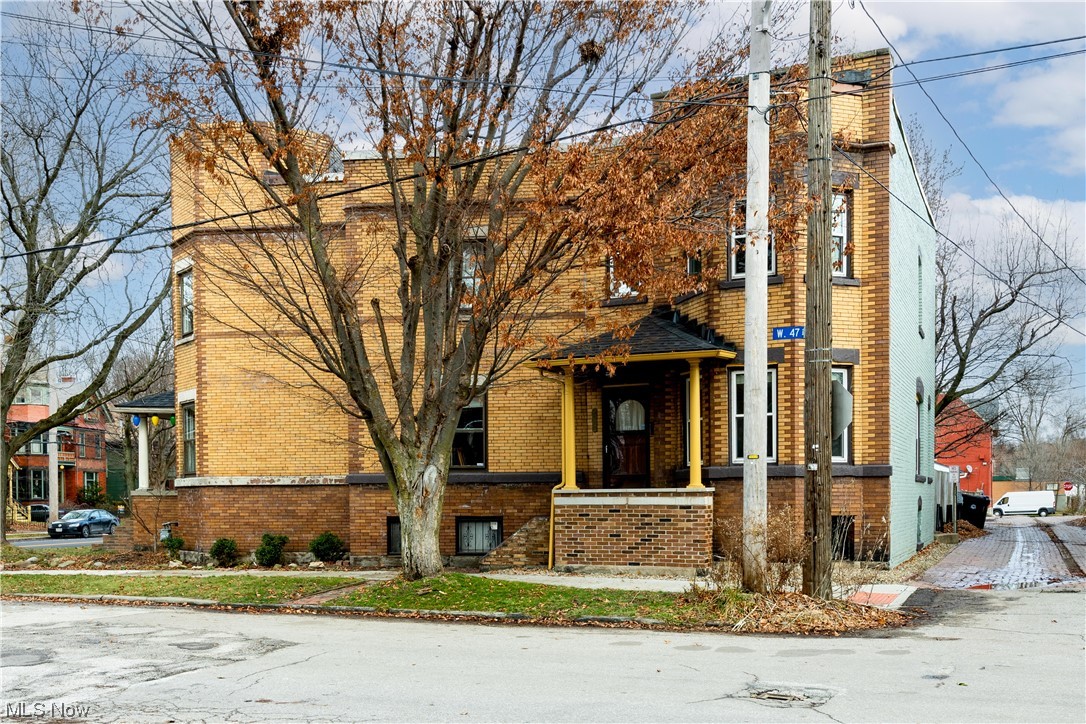 OWN your OWN newly remodeled home in Ohio City for under $300k! Welcome to this Ohio City updated brick row house end unit off historic Franklin Ave. Walk in from a private porch to a spacious open floor family and dining room. Plenty of sunlight comes through the west facing bay windows showcasing the newly refinished original hardwood floor and elegant travertine stone fireplace, cultured marble trim and granite hearth. The kitchen is new in 2023 with soft close white shaker cabinets, crown molding, granite countertops, subway tile, faucet, stainless steel sink, stove, microwave and refrigerator. Going upstairs are 2 large bedrooms with original hardwood floors. One has a large walk-in closet and the other has more bay windows with a cute banister rail nook area. The main bathroom has a walk in glass block/tiled shower and a soaking tub w/retro industrial plumbing gauges. A new vanity, toilet, lighting and subway tile were updated in 2023. The basement has a 2nd full bathroom and laundry area. Out the back door are 2 large courtyards and 2 assigned tandem parking spaces to go along with on street parking right next to the front door. This 1,352 square foot home was professionally painted in and out. Rubber roof replaced in 2022. Vinyl windows 2012. HO fee is only $91 a month. Mortgage rates have headed down and housing inventory is at an all-time low. Don’t let this wonderful Ohio City home pass you by!