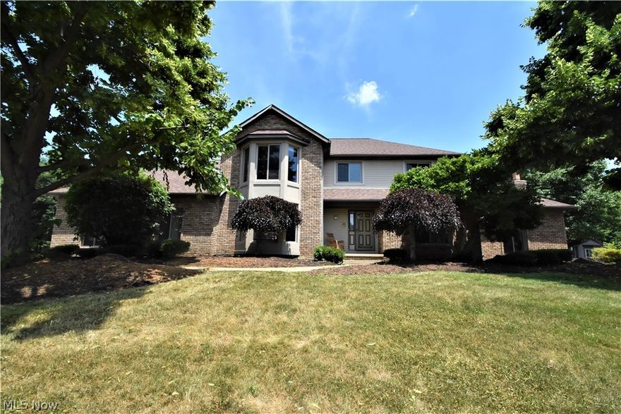 Welcome to this attractive colonial on more than a ½ acre lot in Mayfair Estates. As you enter the home, you are welcomed into the spacious foyer, which leads to the impressive kitchen. Granite countertops offer considerable work space & are complemented by stainless appliances, a desk, & loads of cupboards. The eat-in area offers easy outdoor access to the patio. The dining room, which features a tray ceiling, is excellent for gatherings of family & friends. Step down into the cozy family room, which features a wood-burning fireplace, cathedral ceiling, and a second point of exterior access through a sliding door. A spacious first-floor room with a bay window, full closet, and pocket door offers privacy as a bedroom or office. A large laundry room with excellent storage is conveniently located, & a full bath completes this floor. Continue to the second floor, where you will find a sizable owners’ suite with walk-in closet. The bath has dual sinks, shower, and jetted tub. There are two