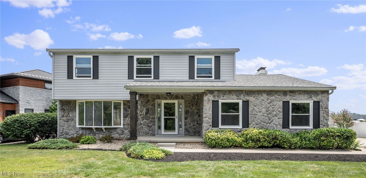 Welcome to this beautiful 4-bedroom, 3.5-bath colonial in Aurora Shores, where every day feels like a getaway! This isn’t just a house… it’s a lifestyle. With almost 2,000 sq ft of living space & a partially finished rec area downstairs, this home offers comfort, space, & lakefront charm. Inside, you’ll find fresh paint & brand-new carpet throughout, giving the entire home a clean, updated feel. Step into a welcoming formal living room with a large bay window, a separate dining room, & a white kitchen with a center island that opens to the family room featuring a cozy fireplace & stunning lake views. Just off the dining room is the four-season sunroom, filled with natural light & surrounded by panoramic lake views. From there, walk out to the expansive back deck—your go-to spot for entertaining, relaxing, & soaking up those peaceful waterfront vibes. Upstairs, you’ll find four spacious bedrooms, including a primary suite with serene lake views, a private ensuite bath, & your own balcony to enjoy morning coffee or evening unwind. The lower level includes a partially finished rec room & a full bathroom—perfect for a playroom, gym, office, or guest space. Outside, enjoy your private lakefront yard, dock access, & absolutely breathtaking views. As a member of the Aurora Shores Homeowners Association (ASHA), you’ll enjoy resort-style amenities including access to the 305-acre Aurora Lake for boating, fishing, & waterskiing, private boat docks, two beaches, two swimming pools, two playgrounds, lighted tennis and pickleball courts, basketball courts, a sand volleyball court, a baseball field, the Marina meeting center, & the Tradewinds Clubhouse. The community also offers a swim team, multiple social groups & events throughout the year, including a Fourth of July parade & picnic, plus close proximity to the Metro Parks for hiking & outdoor adventures. Homes like this don’t come up often—especially with these views & this lifestyle. Come live the lake life dream year-round!
