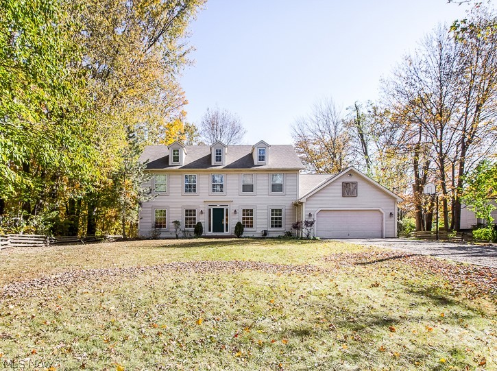 Move right in to this well cared for 4 bedroom 2.5 bath colonial situated on a 1.22acre parklike lot that is located near Metroparks & bridle trails making it perfect for the horse lover. As you enter into the foyer of this home you will see the beautiful hardwood floors & crown molding throughout the living room & dining rooms. Head into the spacious eat-in kitchen with recessed lights, double door pantry & new quality stainless appliances including dual zone convection oven. Step into family room complete with fireplace & glass paneled French doors that open into the living room. A large first floor powder room and a laundry/mud room complete the main level. Head upstairs to the master bedroom which features an additional 12x12 sitting area complete with skylights, built in shelving & decorative fireplace. The master bath features a large vanity, separate shower & soaking tub & has direct access to large walk-in closet. Three additional large bedrooms & another full bath with