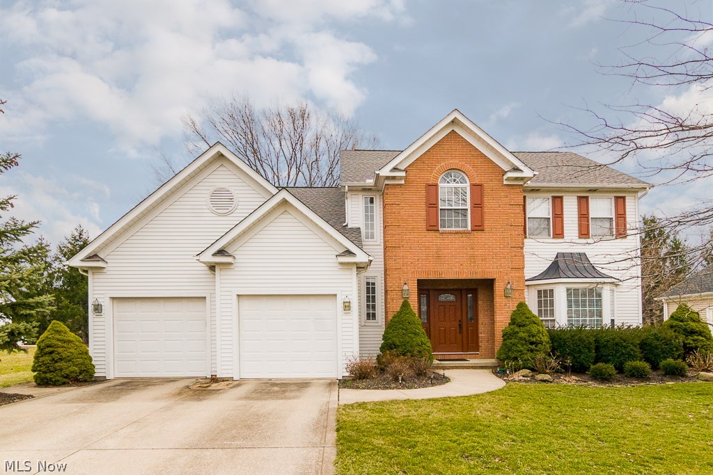 Look no further than this beautiful 4 bedroom 2.5 bath colonial in the heart of Strongsville. This home features an open kitchen with large island with granite countertops and stainless steel appliances which are included in the purchase. The eat in kitchen leads to the backyard with newer patio. The sunken living room with fireplace has vaulted ceilings and large windows allowing in plenty of natural light. The separate family room and dining room that are great for entertaining are right off of the kitchen. A half bath with a granite counter top is off of the foyer. The first floor laundry which leads to the garage includes a washer & dryer set. Head down into the basement that features ample storage and is already drywalled which awaits your finishing touches with flooring to add additional finished square footage to this home. Venture upstairs to the large master suite that has a walk in closet, large soaking tub, separate shower and his-and-hers sinks with granite counter