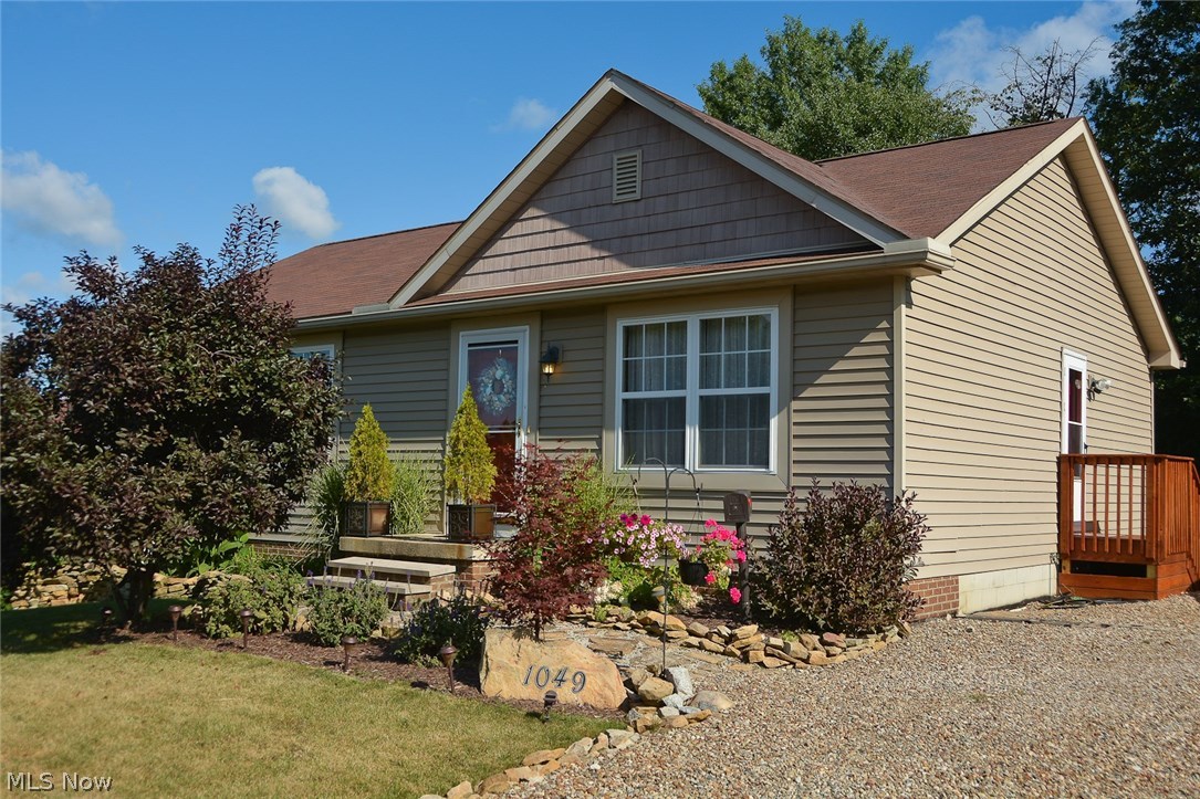 This adorable home was built in 2004 and is move-in ready! It sits on an extra-large lot on a dead end street. A block foundation w/footer is present for a future garage. There are 3 bedrooms and 2 full baths! This home offers a fully appl kitchen with oak cabinets, above cabinet rope lighting w/power outlets, a center island, and wood floors! This open floor plan has vaulted ceilings in the great room (wired with in-wall wire and speakers for 5.1 Surround Sound), the dining area, and the kitchen. There are sliding glass doors to a beautiful 12'x12' deck with steps leading to the private back yard. The master bedroom has recently been painted and is updated with laminate flooring, and there is a ceiling fan and full bath! The 2nd bedroom has been updated with paint, wall covering on one wall, and a ceiling fan. The lower level has a 12 course basement which has been fully insulated in the block, and is just waiting for the buyer's personal touch! Storm doors were added in 2014, with