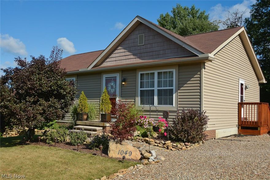 This adorable home was built in 2004 and is move-in ready! It sits on an extra-large lot on a dead end street. A block foundation w/footer is present for a future garage. There are 3 bedrooms and 2 full baths! This home offers a fully appl kitchen with oak cabinets, above cabinet rope lighting w/power outlets, a center island, and wood floors! This open floor plan has vaulted ceilings in the great room (wired with in-wall wire and speakers for 5.1 Surround Sound), the  dining area, and the kitchen. There are sliding glass doors to a beautiful 12'x12' deck with steps leading to the private back yard. The master bedroom has  recently been painted and is updated with laminate flooring, and there is a ceiling fan and full bath! The 2nd bedroom has been updated with paint, wall covering on one wall, and a ceiling fan. The lower level has a 12 course basement which has been fully insulated in the block, and is just waiting for the buyer's personal touch! Storm doors were added in 2014, with