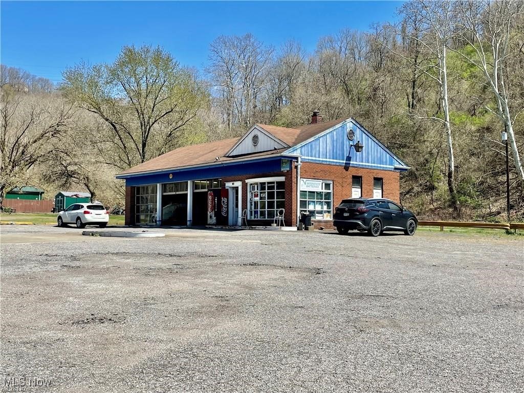 Great commercial property near the new Weirton Industrial Park! This former gas station (pumps removed) and current automotive garage sits at the corner of Pennsylvania Ave and Weir Avenue. It has an office, 3 garage bays with overhead doors, 2 bathrooms and comes with furniture, most tools and 2 lifts. Keep it as a garage or turn it into a quick stop, restaurant, or whatever you desire. The seller has owned the property for decades and loves the location.
