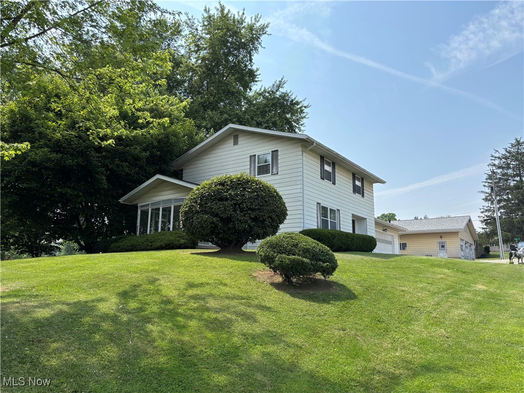 First time on the market in over 50 years. Don't miss the opportunity for this high-profile property that would make a great place for a home-based business or more. This home offers 3-4 bedrooms, 2 full baths, 2 half baths, 2 large living areas, and nice original woodwork. The main floor has the two living spaces with a possible 4th bedroom or office space with connected full bath. Check out the beautiful stone fireplace in the larger living area. The basement is fully plumbed with a half bath, laundry, and kitchenette already in place. You have room to park many vehicles inside with the attached garage and large detached garage/commercial building. The detached building comes with space to park 5 vehicles, a car lift, air compressor, and plumbing hook up for a bathroom and water access. This all sets on .7 acres right on Maysville Pike with a high traffic count. make your appointment today.
