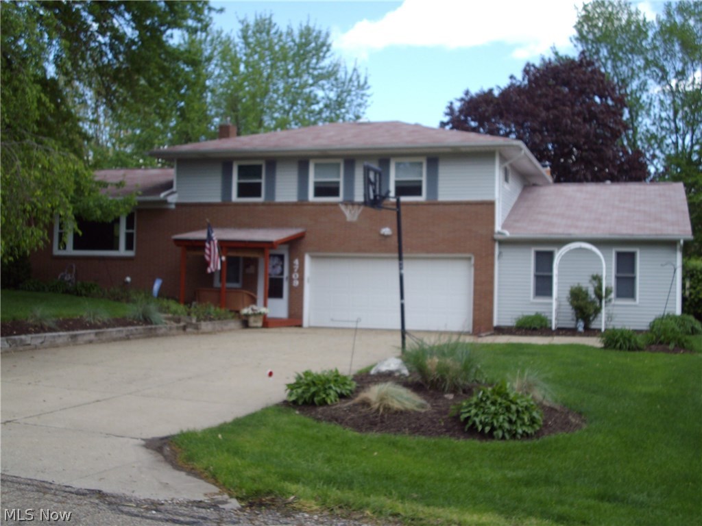 This home is a wonderful place to call home with tons of High End updated features that provide a safe haven for your family 3 bedrooms and 2.5 baths in the main home and offers a In-Law Suite with its own kitchen , living room area and bedroom with full bath built in 1999 or use as a 1st floor Master, Suite has a lovely deck for relaxing pleasure . The home sets on a lovely lush lot in Green and is in a friendly neighborhood minutes from Akron and Canton Interstate. theaters and great restaurants. The Master Bedroom has its own full shower bath, another full bath on the upper floor with double sinks and a half bath located conveniently on the main level . The eat-in kitchen offers Corrine counter tops, Oak cabinets, a slider into the enclosed sun room, a slider to the large back yard and a convenient office on the first floor . The large family room offers plenty of room for friends and family to relax and is accessible to the additional suite, a large brick wood burning fireplace a