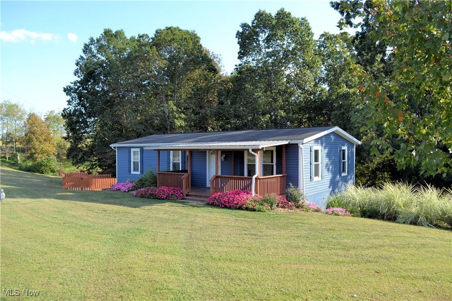 Manufactured home on partially finished basement/garage.  3 bedrooms, 2 full baths.  Updates: Vinyl siding, vinyl windows, Porch, hvac system, Tub/shower, bathroom vanity. 
Above pool with nice deck.  
2.16 +/- acres
County water and a septic