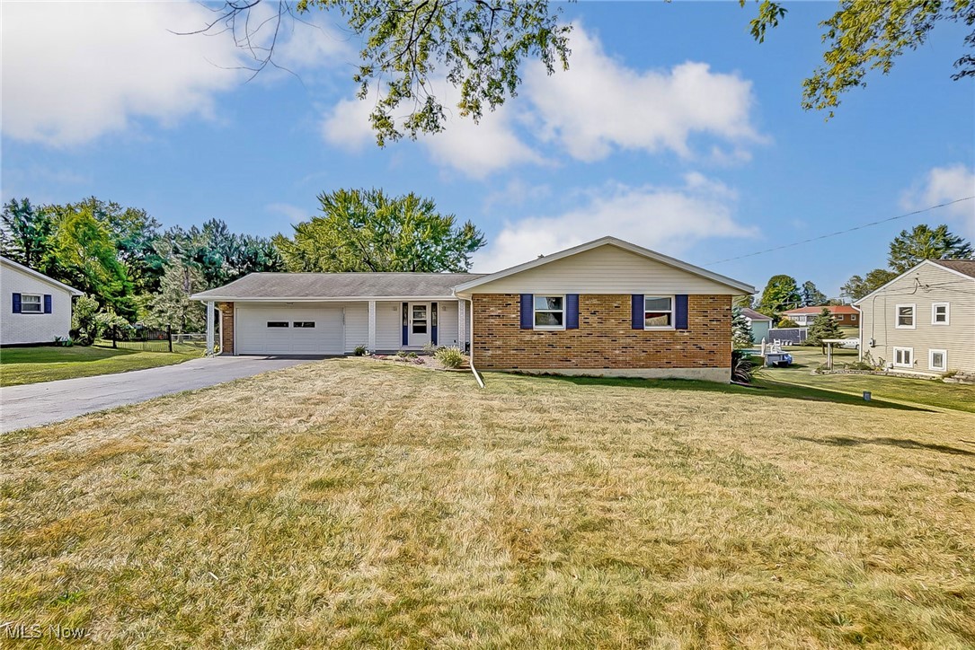 Situated on 1.33 acres, this well-kept ranch style home boasts 3 bedrooms, 2 full bathrooms, a covered deck with a scenic backyard view, & more! Entering the front door you'll find a spacious living room opening to the dining room & kitchen areas. Beautiful hardwood floors flow down the hall & into the 3 generous bedrooms (including an owner suite with bath access), 2 full bathrooms, & a family room featuring a cozy wood burning fireplace accented with a brick hearth. The partially finished full basement is great for additional living space (easily create movie / game / rec areas) & suits all storage needs! Easily host guests whether inside or out & enjoy cooking out on the deck & taking in the view of the backyard (great for kids AND pets)! Fully paved driveway & 2 car attached garage!
