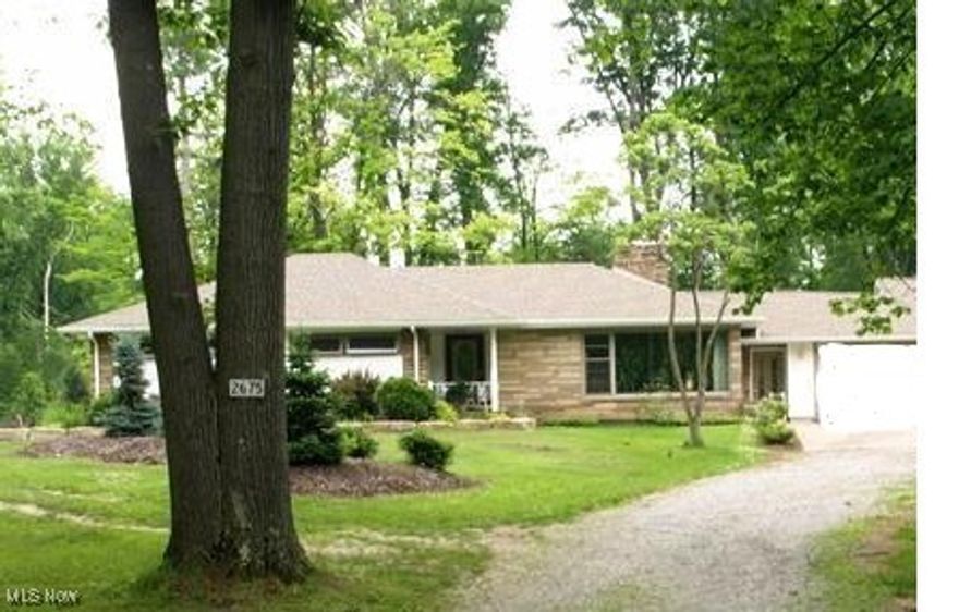 Enjoy peaceful country living on approximately 3.9 acres with this well-maintained 3-bedroom ranch offering versatility, space, and privacy. The home features a separate-entrance, finished lower-level mother-in-law suite, ideal for multi-generational living, guests, or extended living space.
Inside, you’ll find two fireplaces—one in the spacious living room and another in the lower-level rec room—providing warmth and additional gathering areas. The home includes two full bathrooms and a thoughtfully designed layout with charming details throughout. Laundry is on the lower level, basement of the home. 
The country kitchen features stainless steel appliances, a farmhouse sink, and beautiful pocket doors with stained-glass windows, adding character and functionality. Additional highlights include a breezeway with a freestanding fireplace, a patio overlooking the property, and a pond that enhances the serene setting.
Car enthusiasts and hobbyists will appreciate the attached oversized garage accommodating approximately four vehicles. Solar panels offer energy efficiency and long-term savings.
This property offers the perfect blend of rural charm zoned for agricultural use if desired with a small pond located in the wooded acres. Close proximity to highways and stores offers modern conveniences, and flexible living options. Recent upgrades include New septic in 2021, New heat and central air in 2021, New living room windows in 2023, New water heater in 2024. Call today to schedule your private showing.