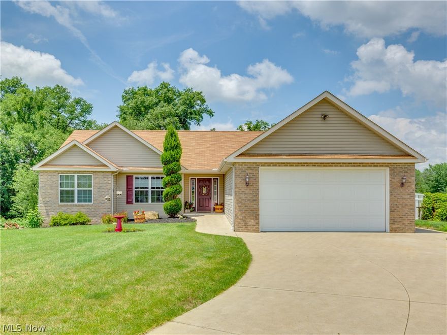This beautiful brick/vinyl ranch is situated @ the end of a cul de sac in Perry Local School District. Built in 2007 it offers 3000 plus sq ft. Enter through the foyer to take in the open concept & high vaulted ceilings. The living room has gas fire place set in beautiful wood & tile. The adjoining versatile dining area/sunroom looks out over a spacious vinyl fenced in backyard & patio. The kitchen has breakfast bar seating, large walk in pantry, vaulted ceiling & recessed lighting. The oak cabinets and ceramic tile outline this space.  Off the kitchen, the first floor laundry room provides ample closet, sink and cabinet space with garage access. The Massive master bedroom is highly adaptable to make this space your own. Master bath has a 10x7 walk in closet, shower & large double sink vanity. 1 of 3 additional bedrooms is carpeted with large closet space. 2 of the 3 bedrooms has ceiling fan & could be used as an office. 3 of 3 bedrooms is located on lower level with carpet, double clo
