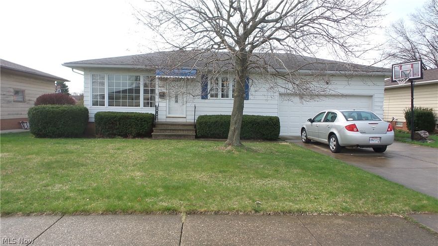 Nice 3 bedroom ranch with 1.5 baths.  Hardwood floors in LR, DR and 3 bdrms.  Kitchen recently repainted and newer flooring, wall oven and counter top range.   Large Windows make a nice light filled open floor plan.  Ceiling fans thru out.  Large closets in the bedrooms.  Two utility closets.  Full bath could use updating.  Half bath on first floor recently remodeled.  Full basement is partially finished with large recreation room and separate good size laundry area.  Another basement area has lots of cabinet space for storage.  Attached two plus car garage with newer garage door, center drain and electric.  A 3 season sun room behind the garage that leads to a cement patio area thru a slider door.  Full fenced in yard.  A couple of newer windows.  Updated Electrical panel.  Front door and screen door newer.  This home will be super cute with a few of your touches on it.  Walking distance to park and city pool.  Tree lined street.  Owner is providing a One Year Home Warranty for Buyer'