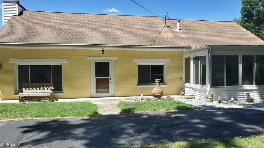 Looking for privacy in the heart of Elyria? This property is a half acre treasure! Three bedrooms, two baths with master bedroom on the main floor as well as utility room. The four season room overlooks the front yard with plenty of trees for privacy. The second level has kitchen area, bedroom, and full bath. Two view this unique home CALL for a personal tour!